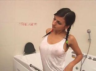Pigtailed brunette stripping in toilet